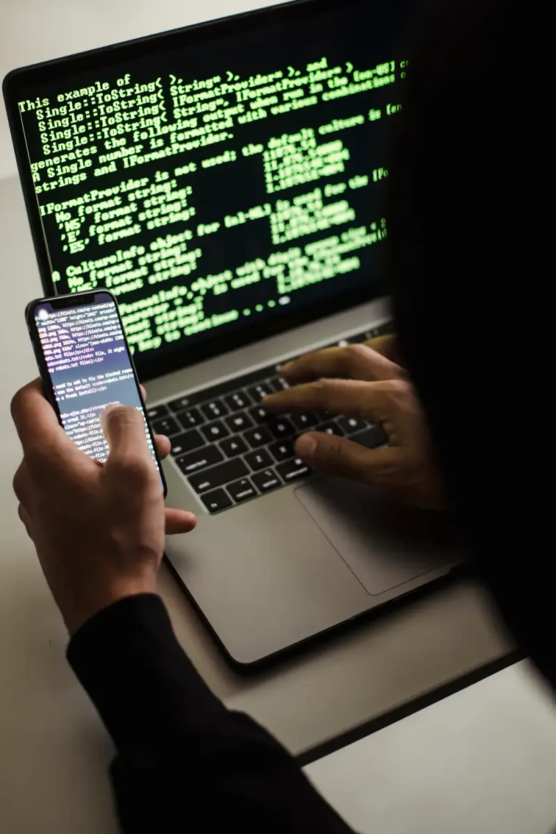 Close-up of hands typing on laptop keyboard working with AI tools