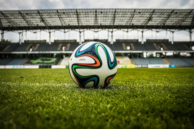 Soccer ball on Premier League pitch representing the sports betting test used to evaluate AI model prediction accuracy